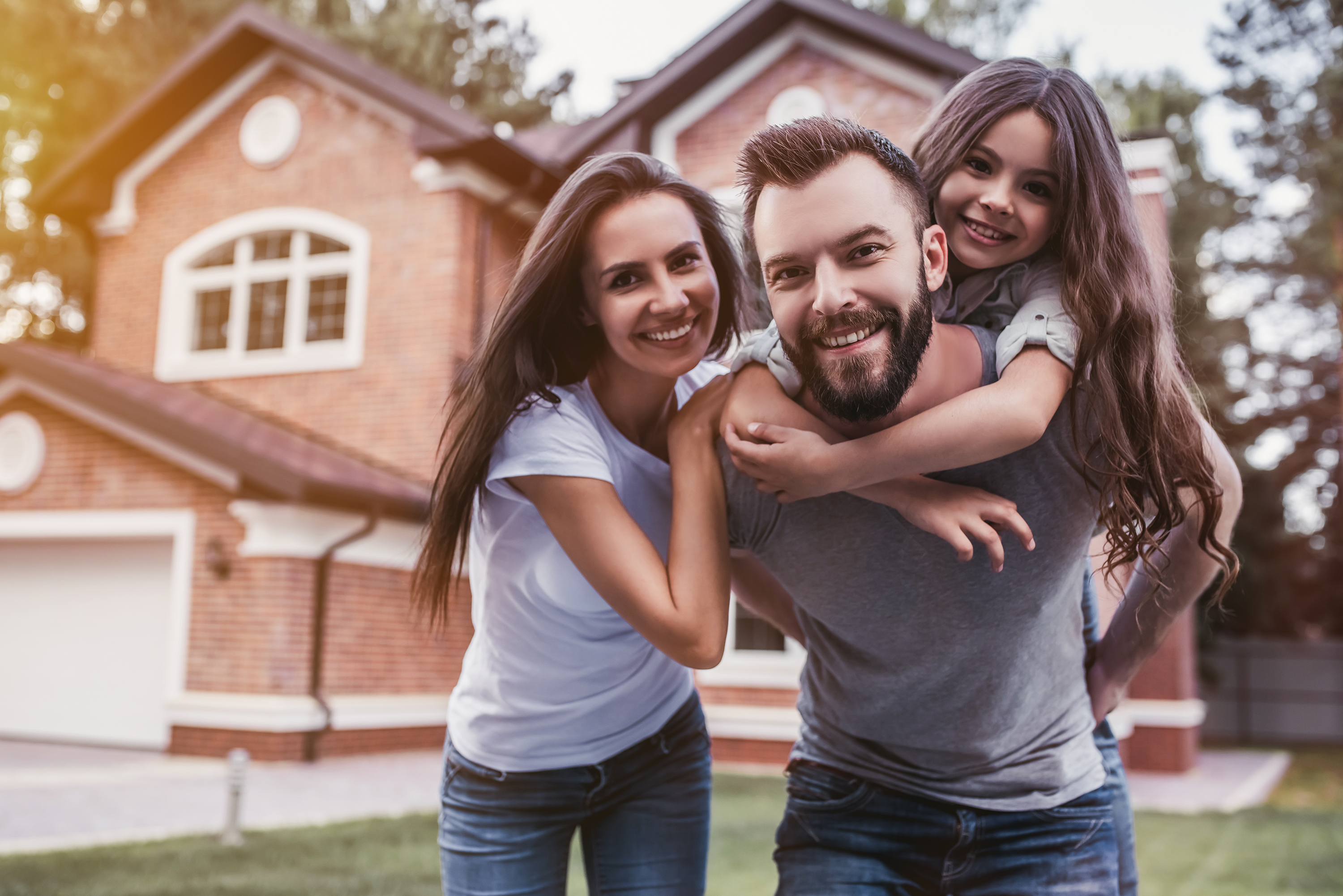 Family in front of Home