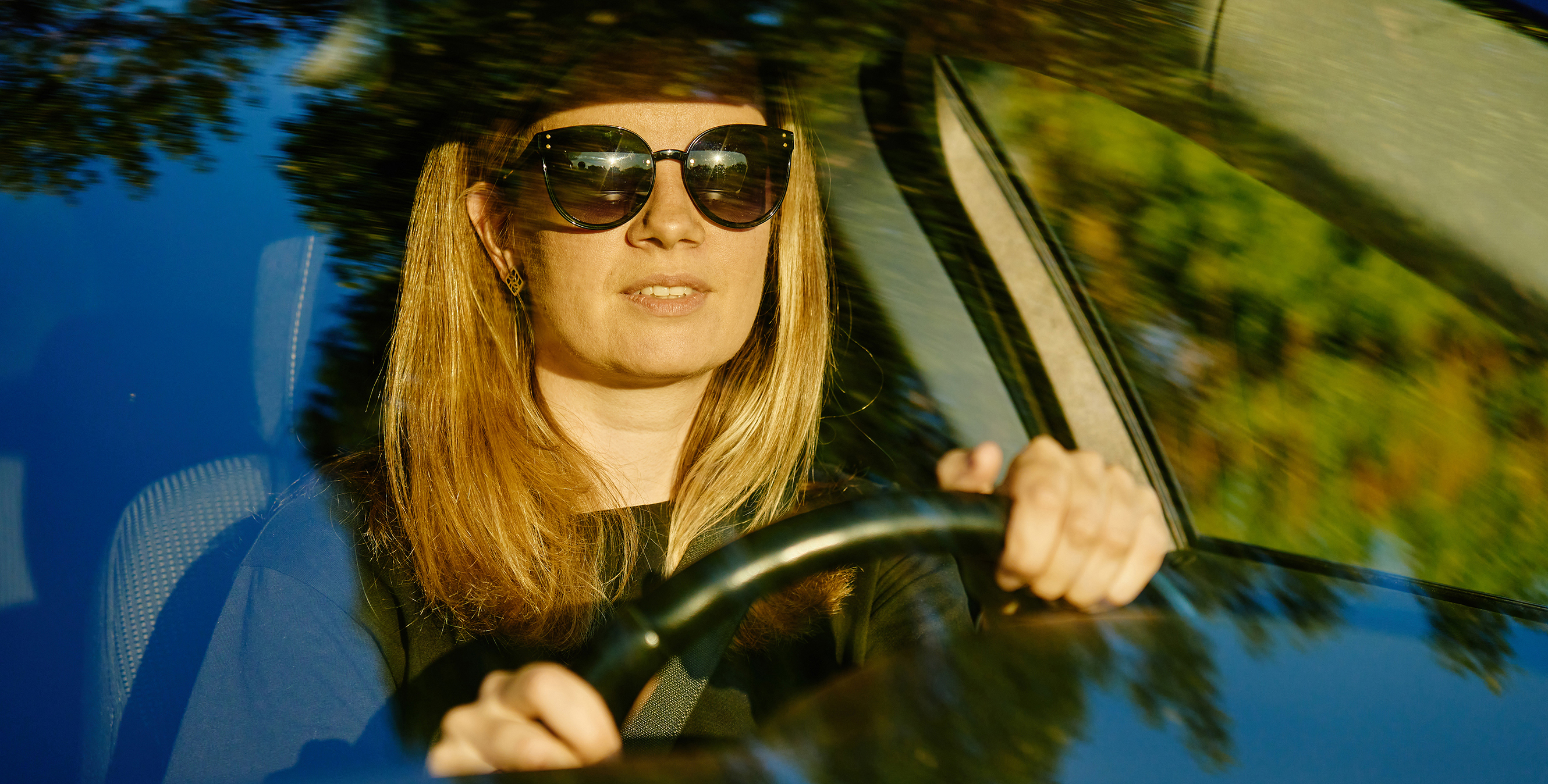 Female Driver Wearing Sunglasses