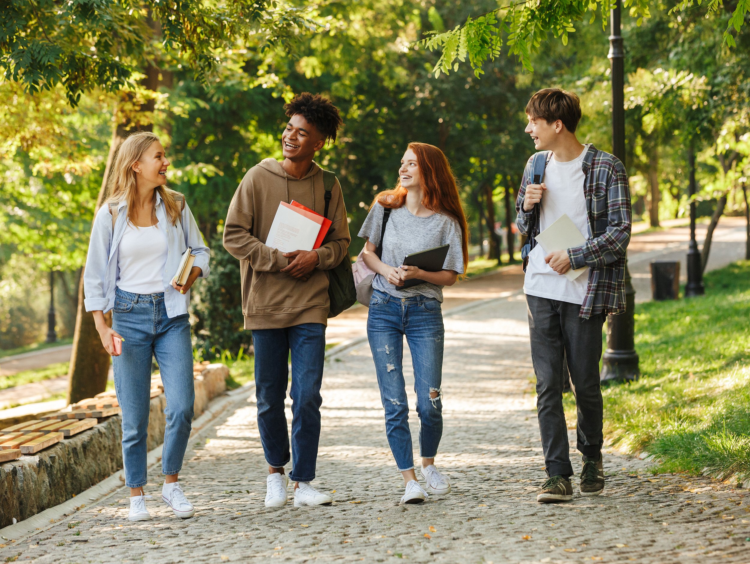 College students walking on cobblestone path