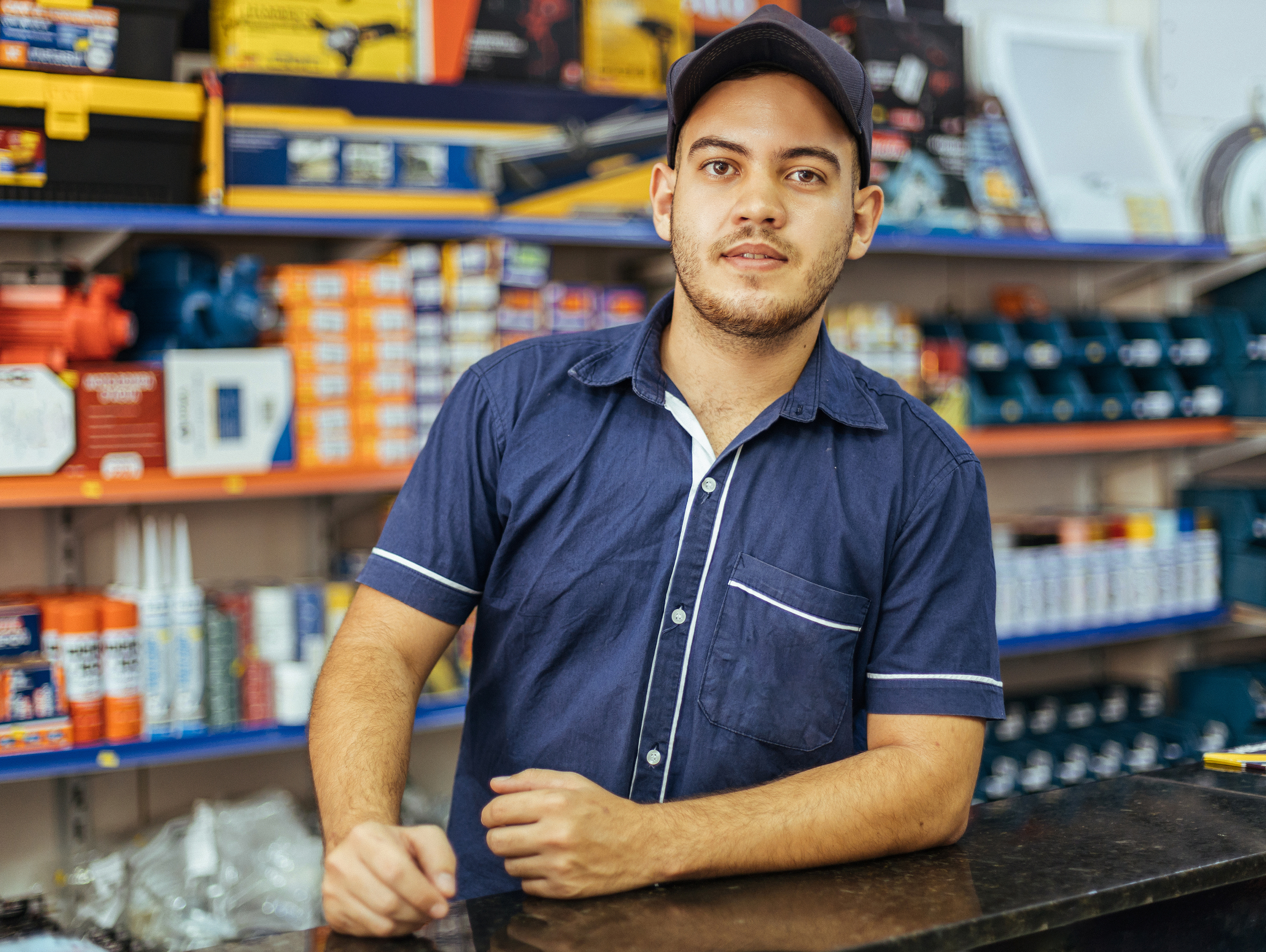 Male worker at auto parts store counter